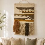 Handwoven boho macrame wall hanging with tassels in natural cotton and earthy brown tones for modern living room wall decor.