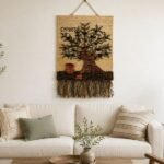 Handwoven olive tree wall hanging with terracotta pot on natural jute
